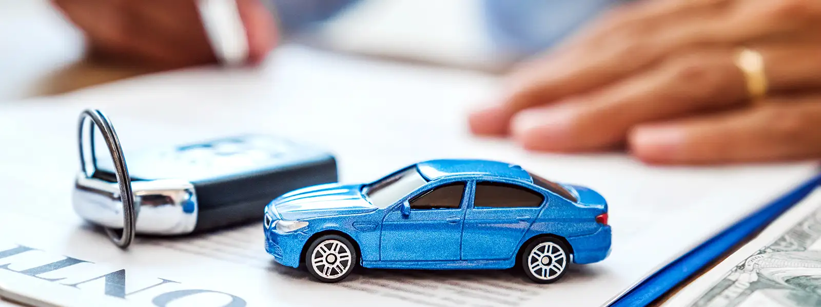 Car Loan Contract with Car Key and Toy Car