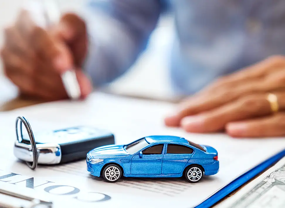 Car Loan Contract with Car Key and Toy Car