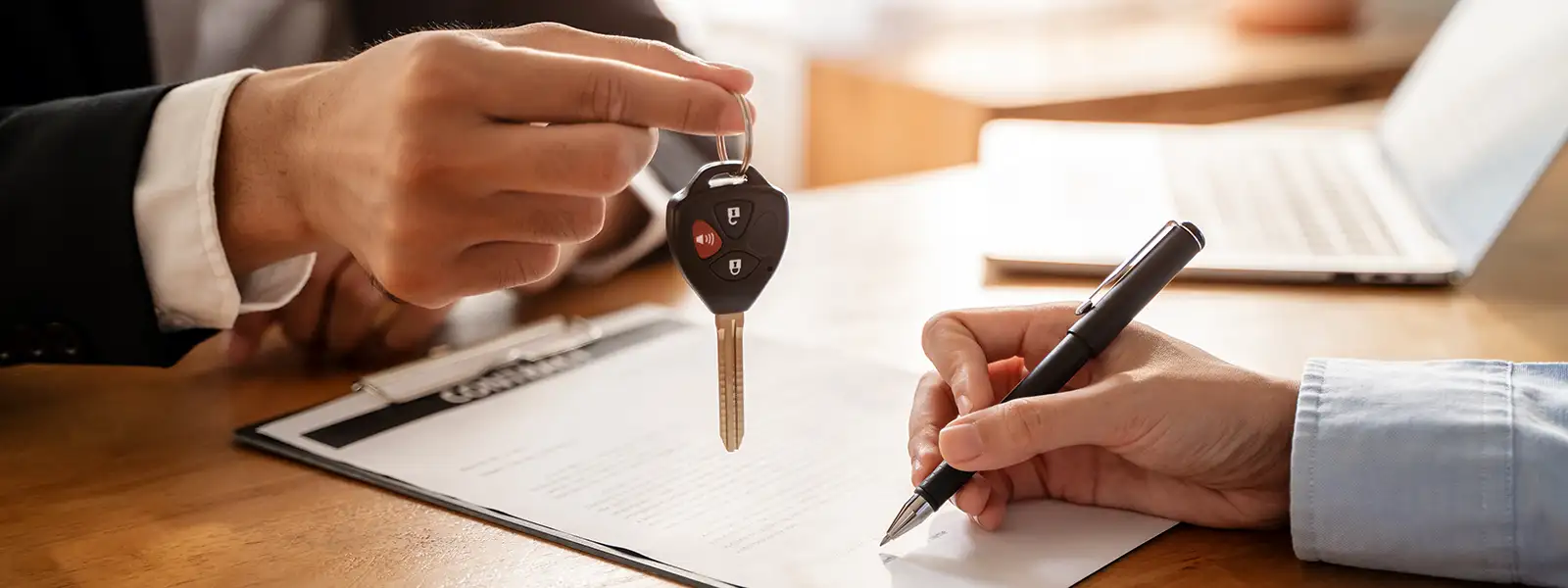 Signing a Car Loan Contract