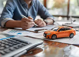 Man Signing an Auto Loan